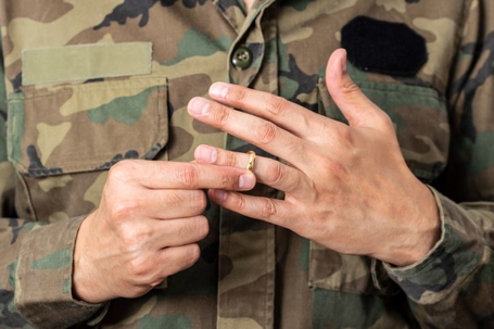 serviceman taking off wedding ring
