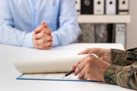 military man and paperwork