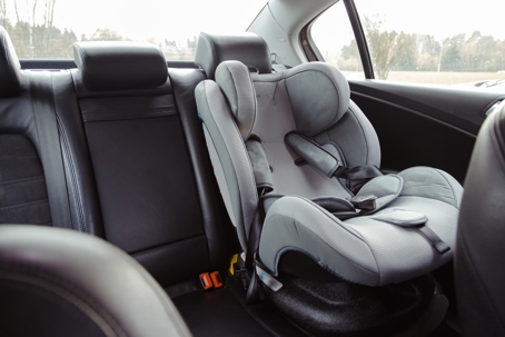 Child car seat in the rear passenger seat of car