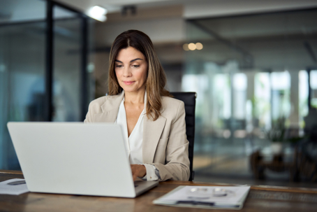 business woman looking at laptop