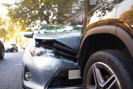 two cars in an accident on street