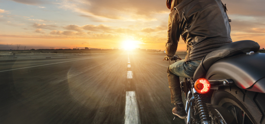 Motorcyclist riding on a highway near Pueblo, Colorado