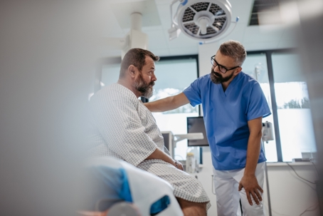 doctor consulting a patient after a car accident